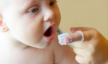 when do you start brushing baby's teeth