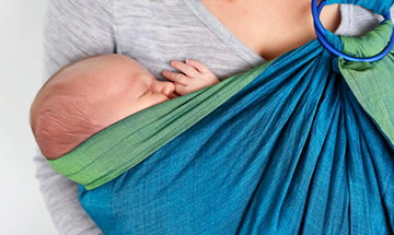 baby sleeping in a carrier