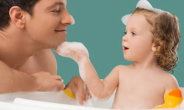 adult and baby washing hair