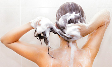 adult using shampoo